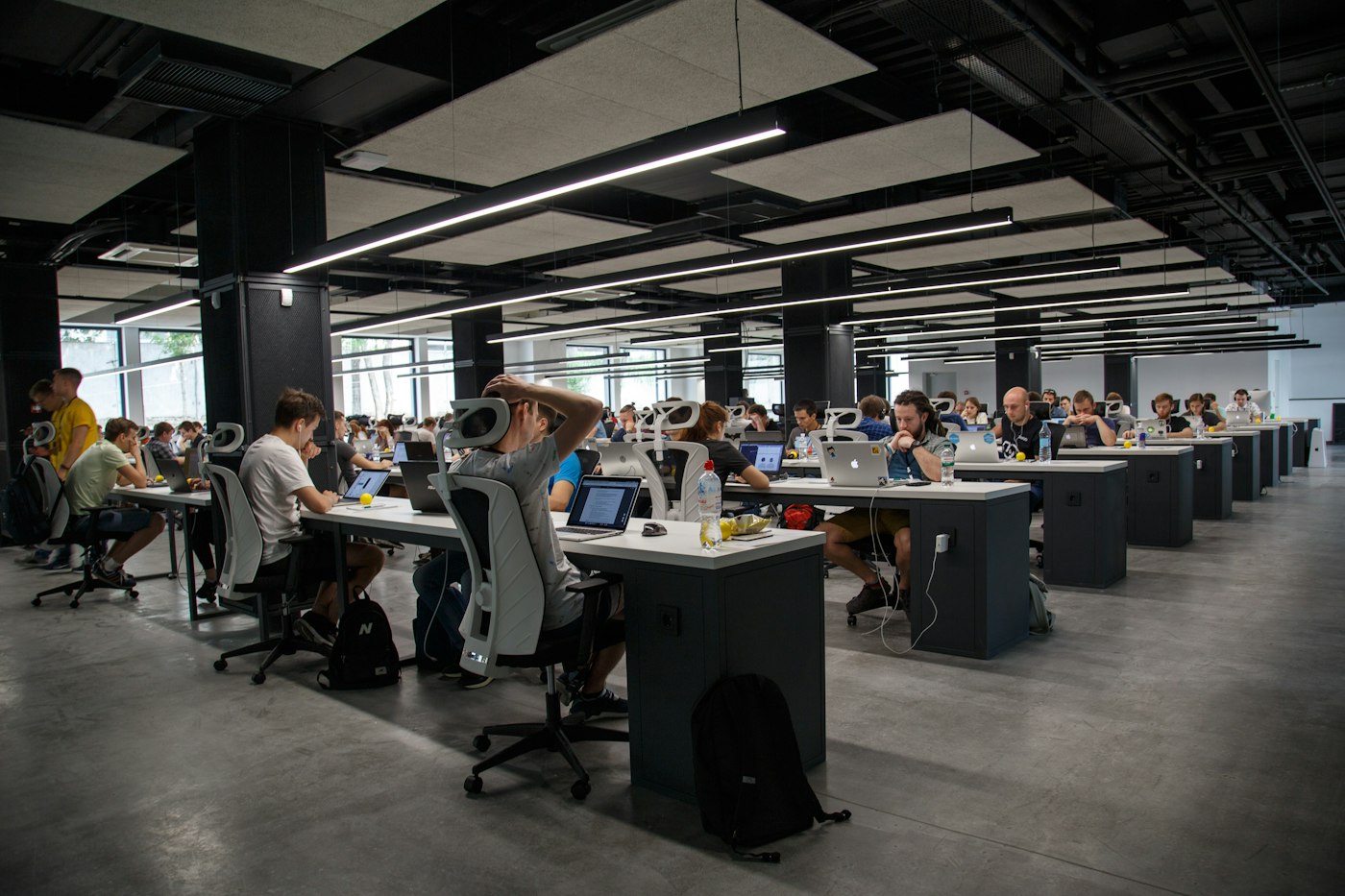 Engineers and analysts reviewing live enterprise systems and cloud operations
